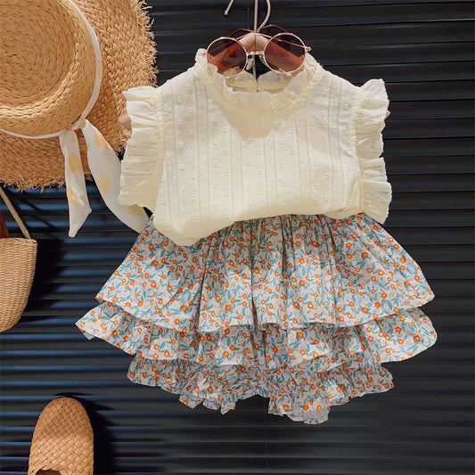Toddler white ruffled sleeveless top with floral tiered skirt, sunglasses, straw hat, and woven shoes set